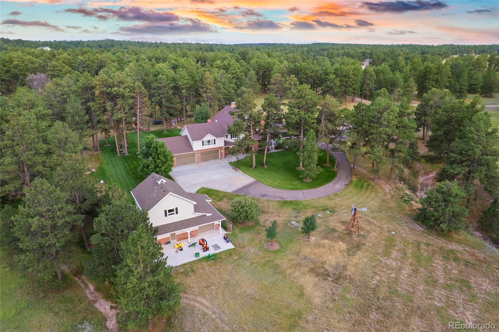 38666 County Road 21 Elizabeth, CO 80107 - Photo 46 of 48 an aerial view of a house with a garden and lake view