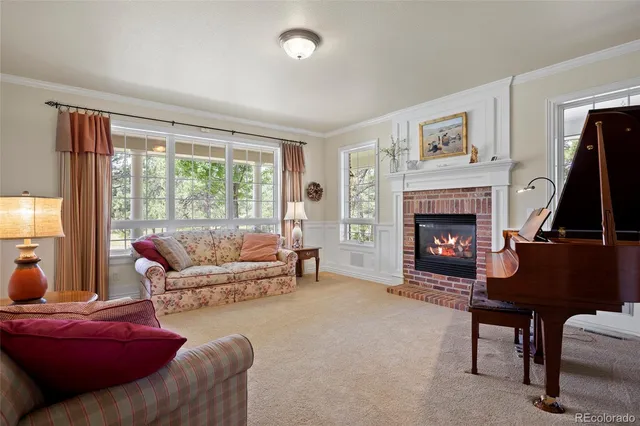 a kitchen with white cabinets and a window