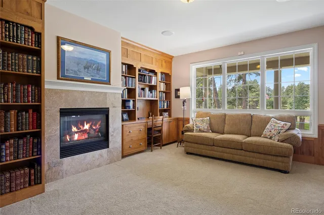 a front view of a house with a yard table and chairs