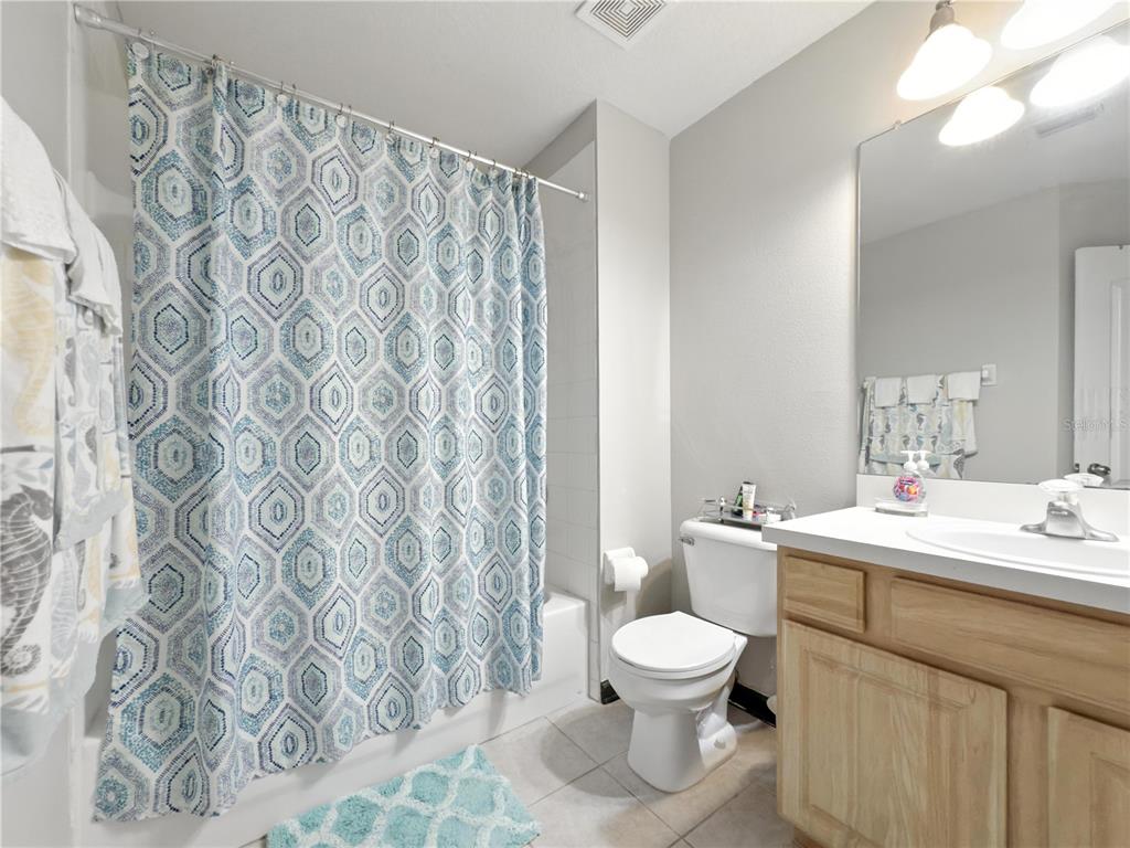 2617 Redford Way Wesley Chapel, FL 33544 - Photo 19 of 21 a bathroom with a toilet sink and mirror