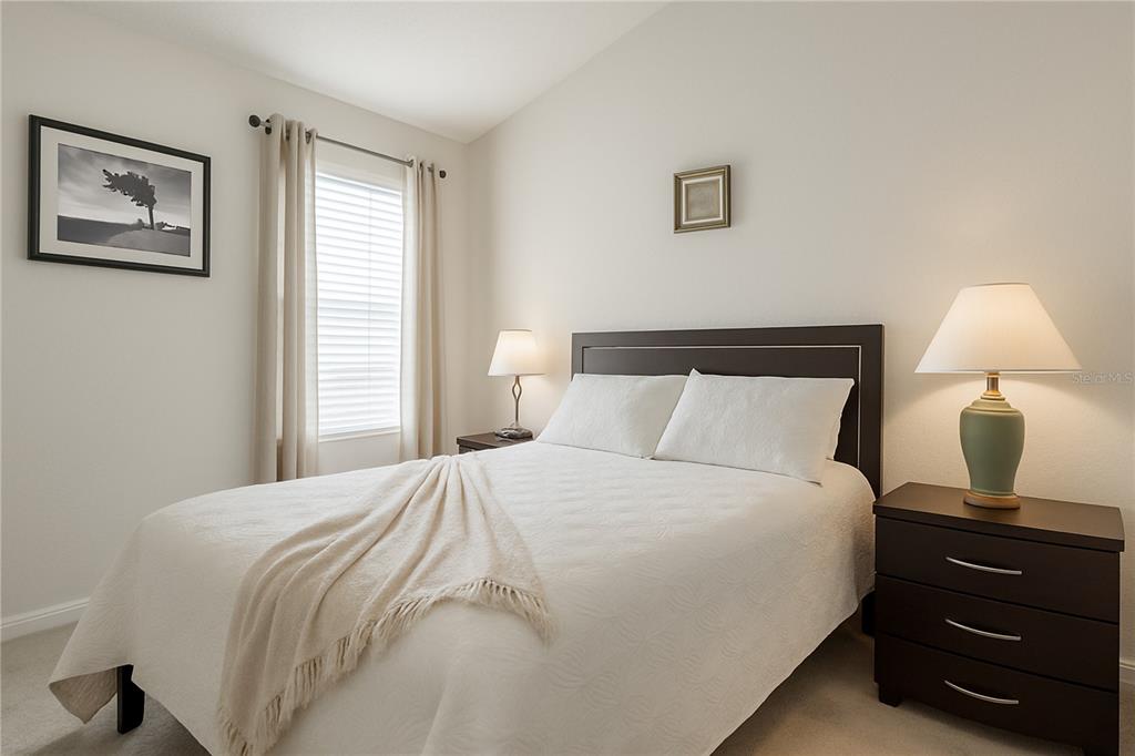 2617 Redford Way Wesley Chapel, FL 33544 - Photo 20 of 21 a bedroom with a bed and a window