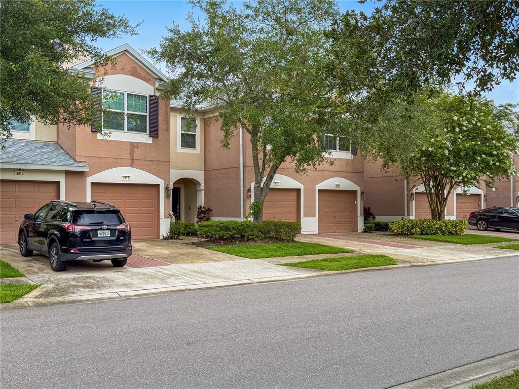 2617 Redford Way Wesley Chapel, FL 33544 - Photo 2 of 21 a car parked in front of a house