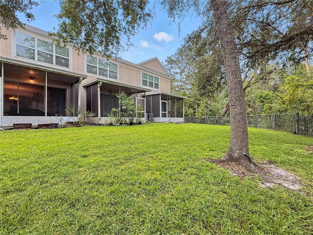 2617 Redford Way Wesley Chapel, FL 33544 - Photo 21 of 21 a front view of a building with a garden