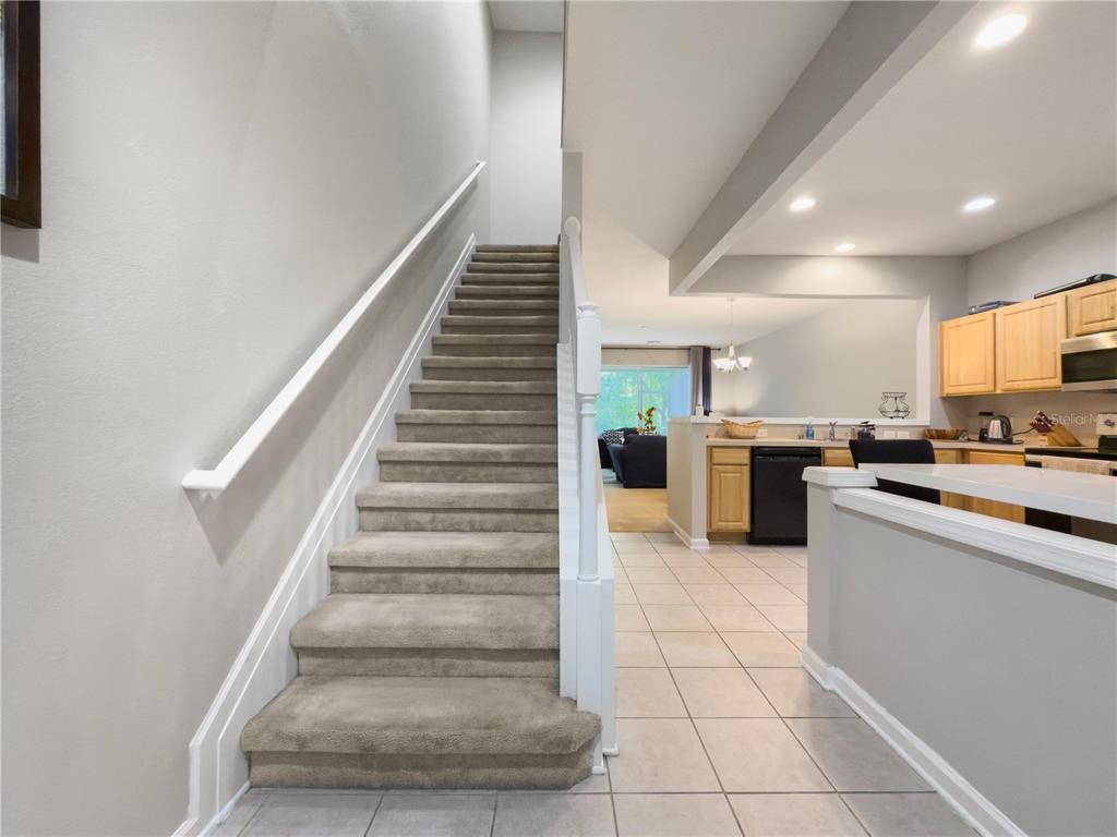 2617 Redford Way Wesley Chapel, FL 33544 - Photo 4 of 21 a kitchen with cabinets and white stainless steel appliances