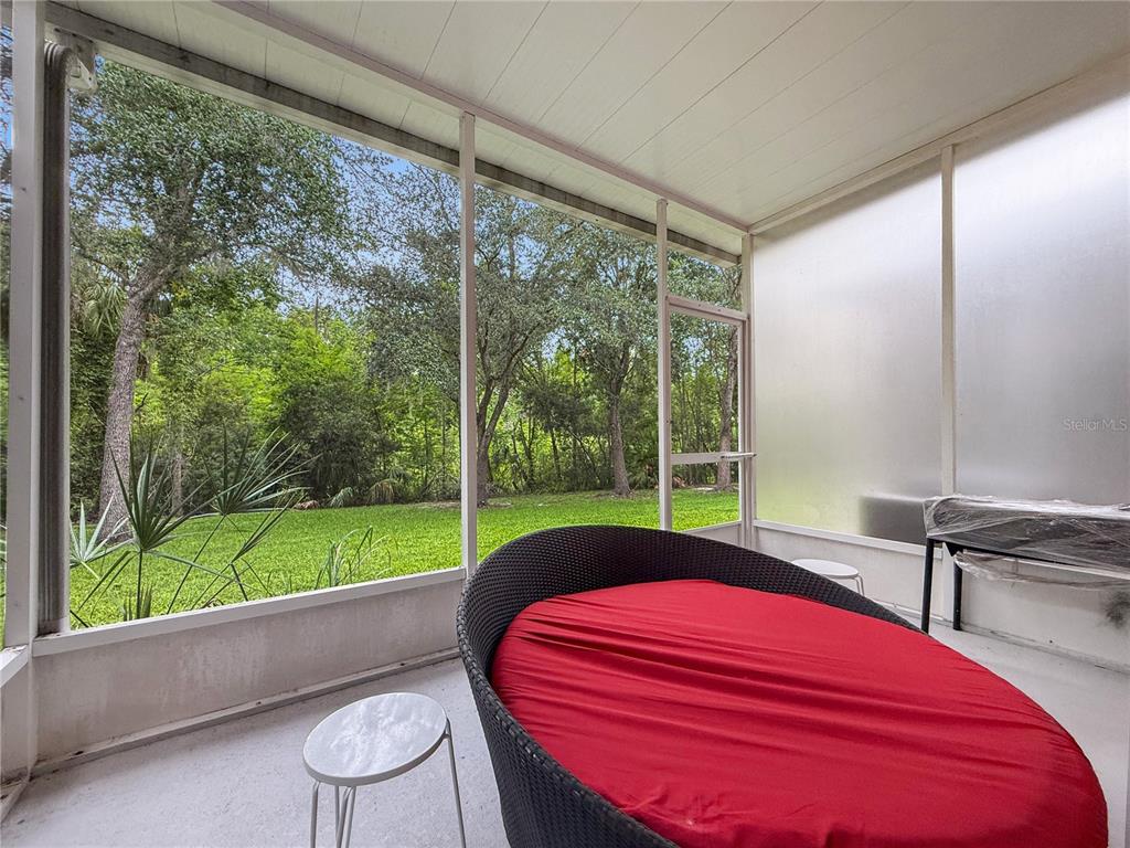 2617 Redford Way Wesley Chapel, FL 33544 - Photo 10 of 21 a bed sitting in a room next to a large window