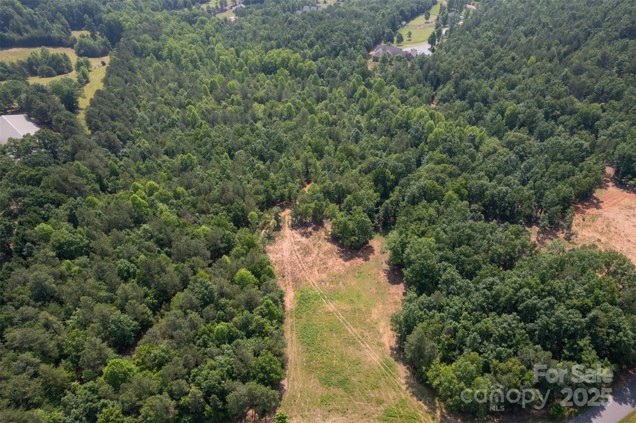 Lot 11 Prospect Point Drive Tryon, NC 28782 - Photo 6 of 16 an aerial view of residential house with outdoor space and trees all around