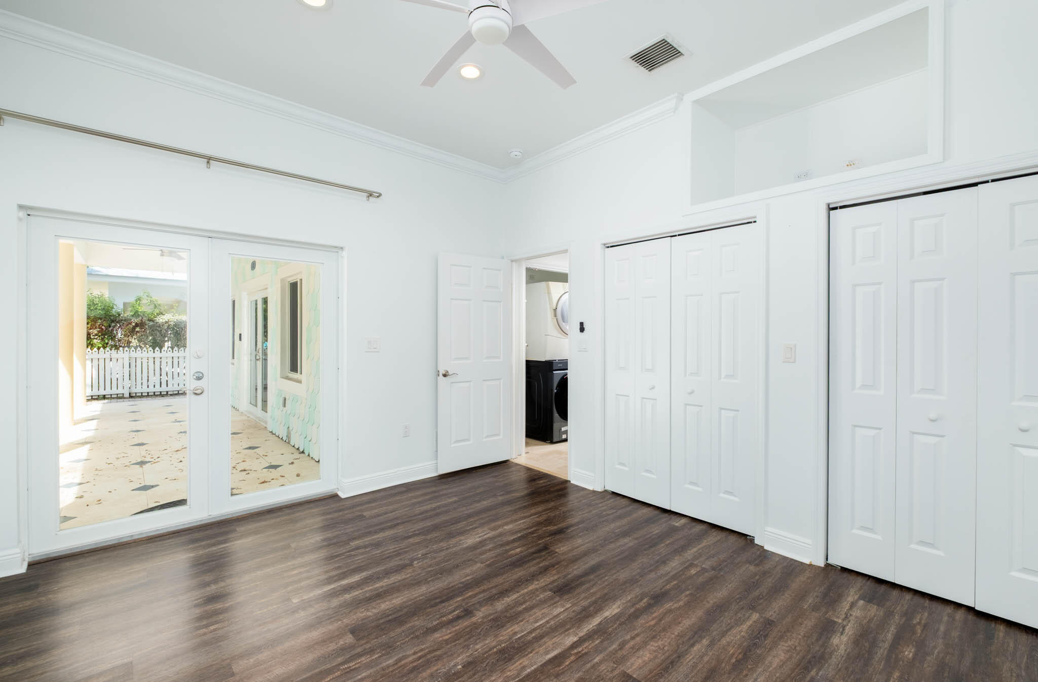 118 1st Street Key Largo, FL 33037 - Photo 13 of 25 a view of an empty room with wooden floor and a window