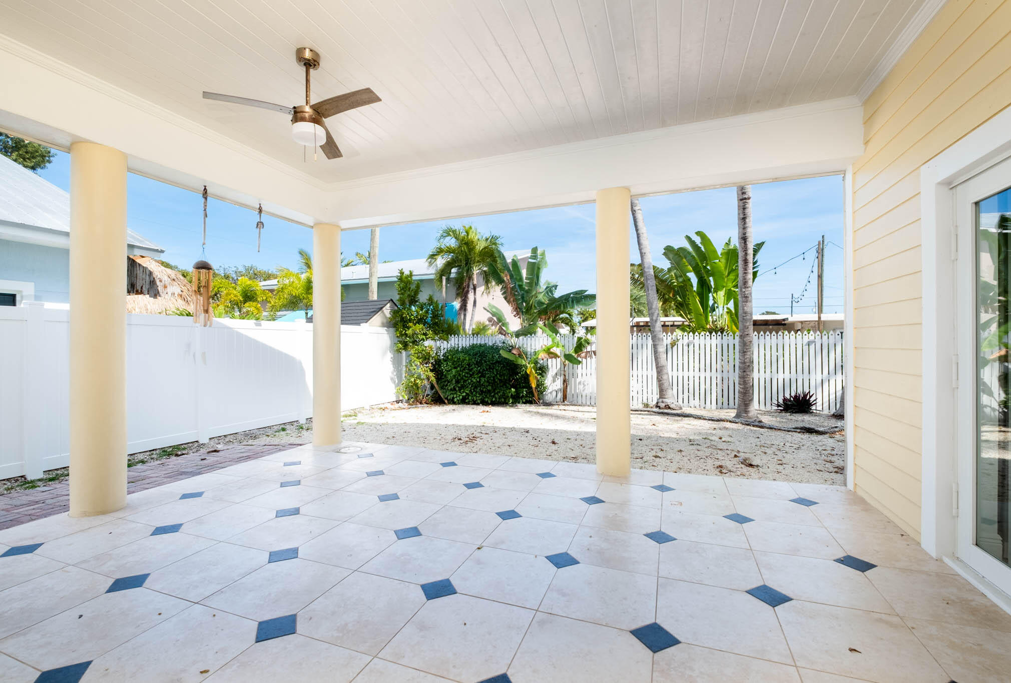 118 1st Street Key Largo, FL 33037 - Photo 18 of 25 a view of a hallway with potted plants in front of door