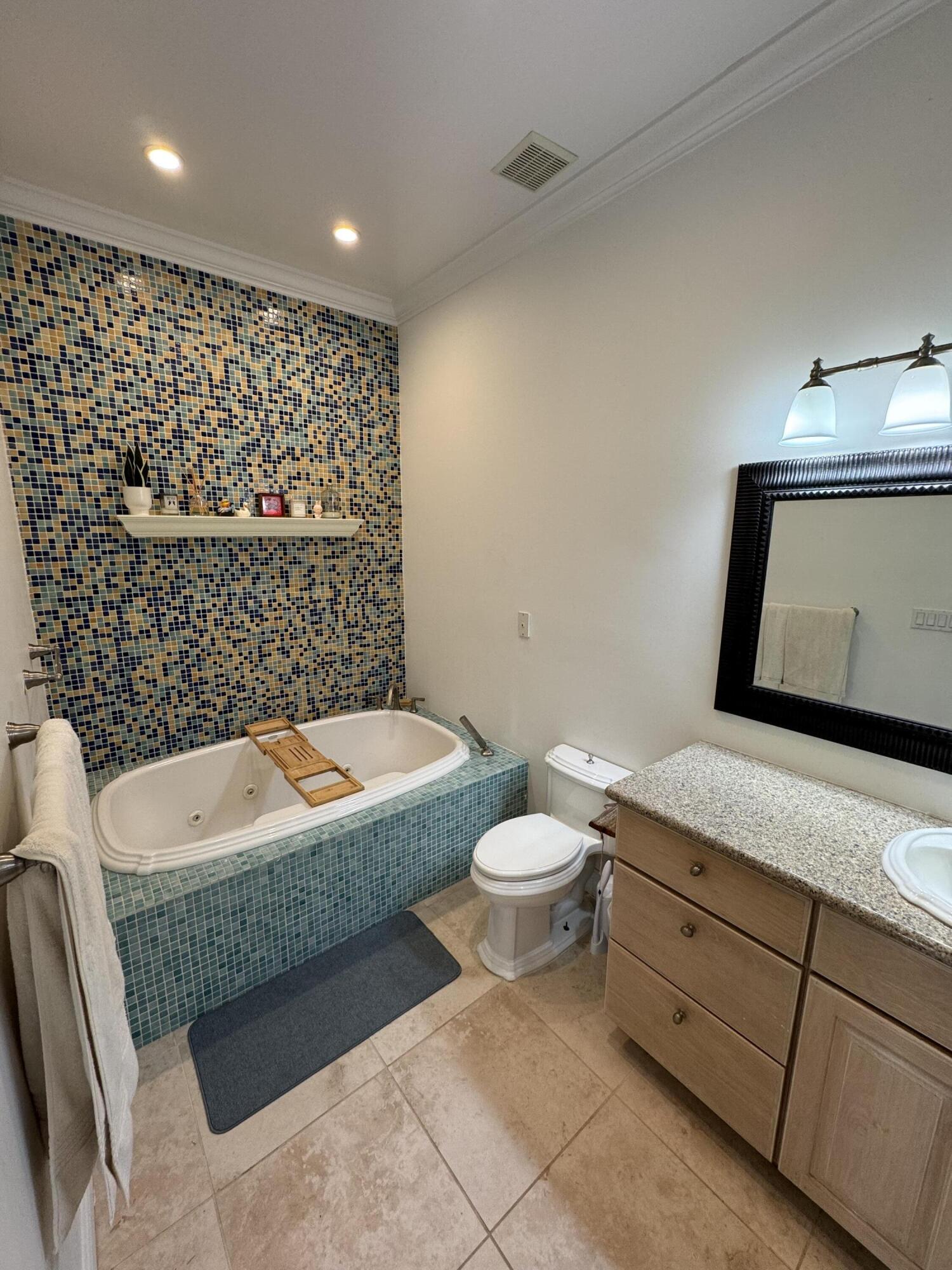 118 1st Street Key Largo, FL 33037 - Photo 3 of 10 a bathroom with a sink a toilet and mirror
