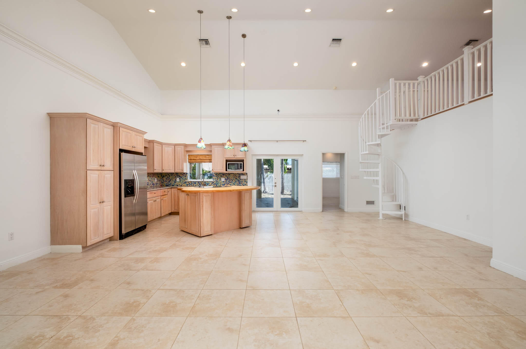 118 1st Street Key Largo, FL 33037 - Photo 5 of 25 a kitchen with stainless steel appliances a refrigerator and a stove top oven
