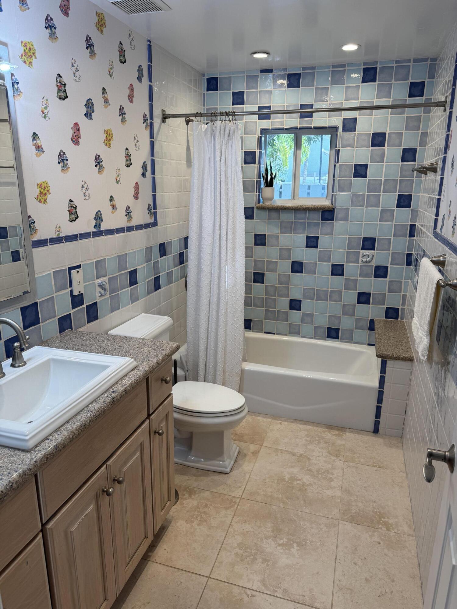 118 1st Street Key Largo, FL 33037 - Photo 6 of 10 a bathroom with a sink a toilet and shower