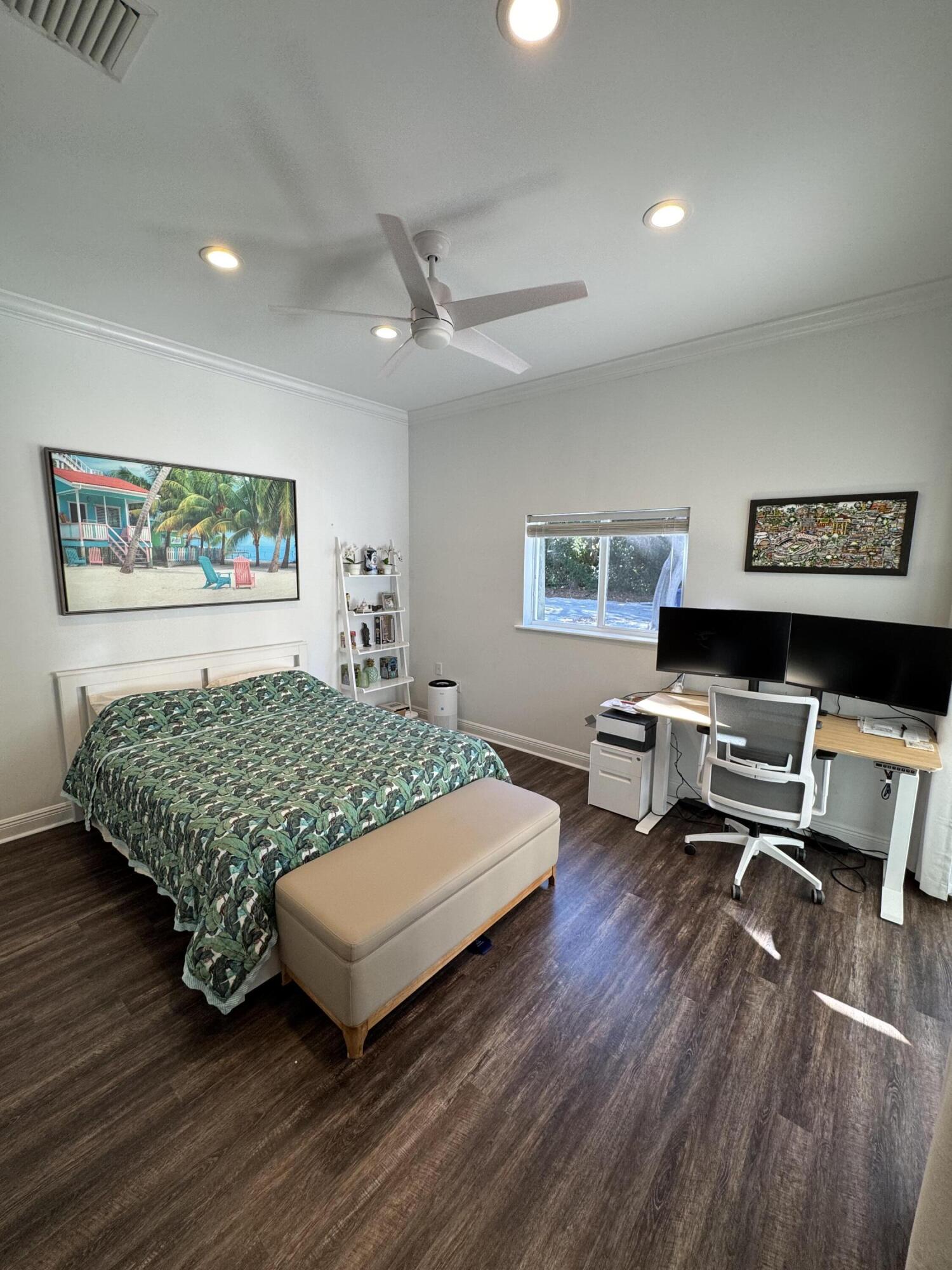 118 1st Street Key Largo, FL 33037 - Photo 7 of 10 a bedroom with a bed window and couch