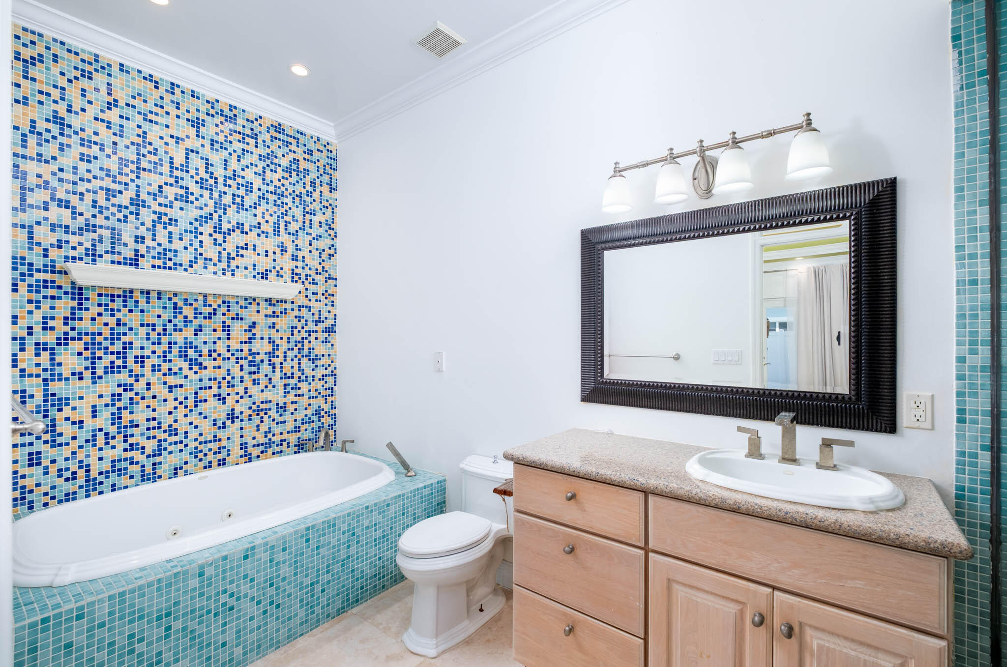118 1st Street Key Largo, FL 33037 - Photo 10 of 25 a bathroom with a bathtub sink vanity mirror and toilet