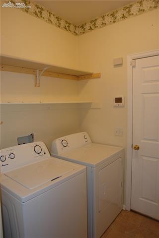 7596 Coffee Road Peyton, CO 80831 - Photo 19 of 25 Laundry room. Washer/Dryer included