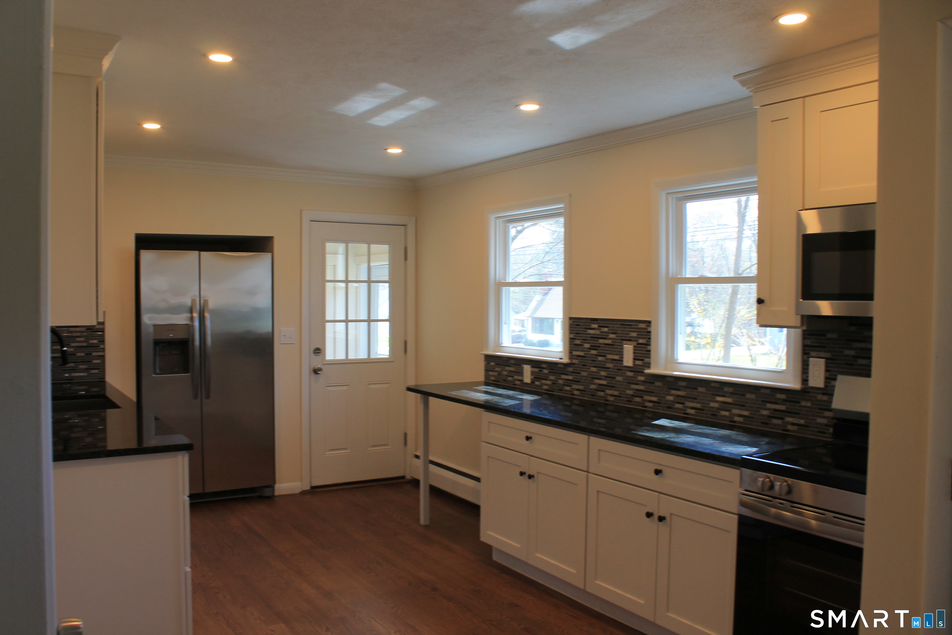 134 Sunset Street Windsor Locks, CT 06096 - Photo 3 of 23 a kitchen with stainless steel appliances granite countertop a sink a stove and a refrigerator