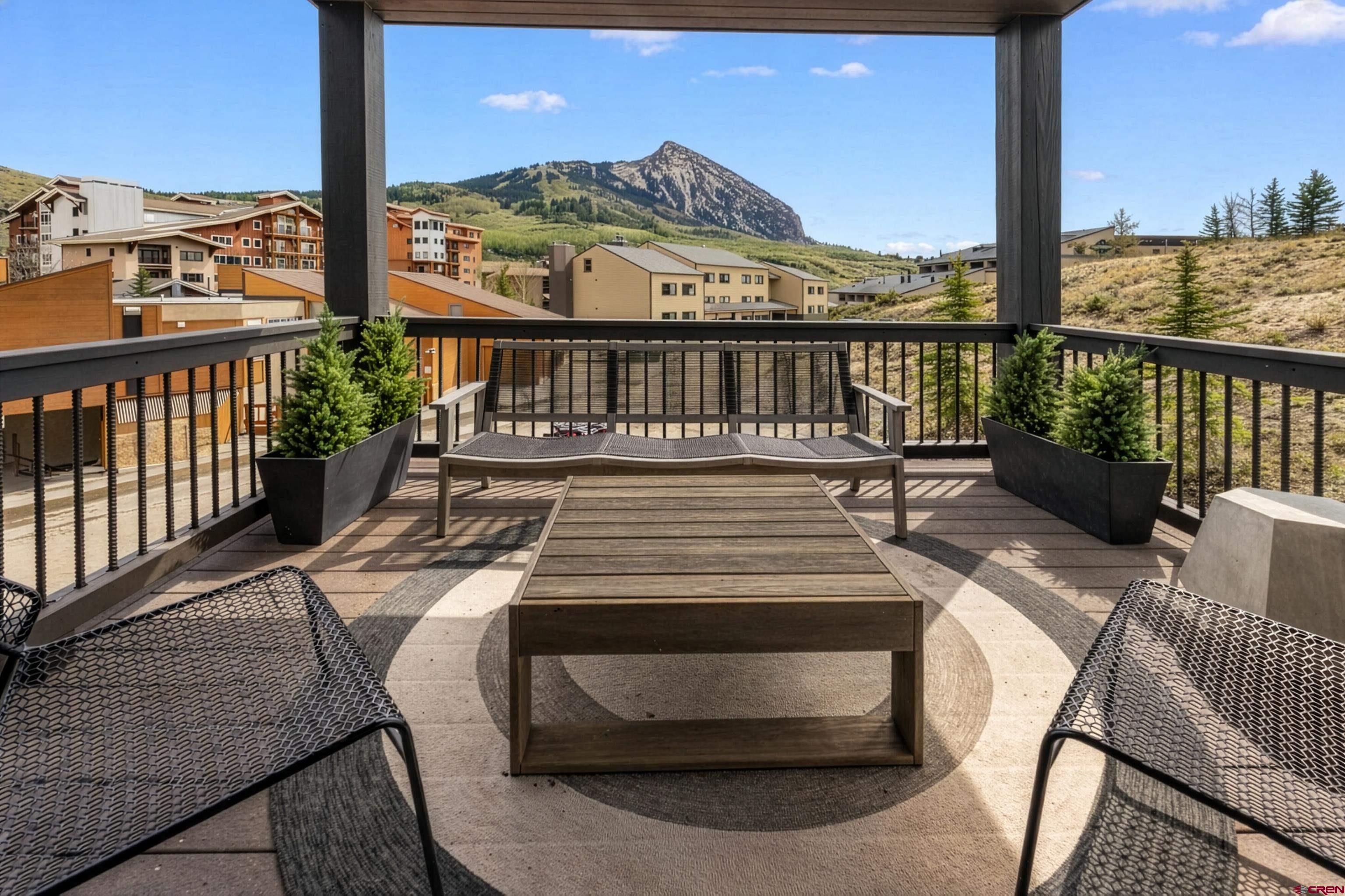 621 Gothic Road, Unit 2A Crested Butte, CO 81225 - Photo 11 of 34 a view of a balcony with wooden floor and furniture