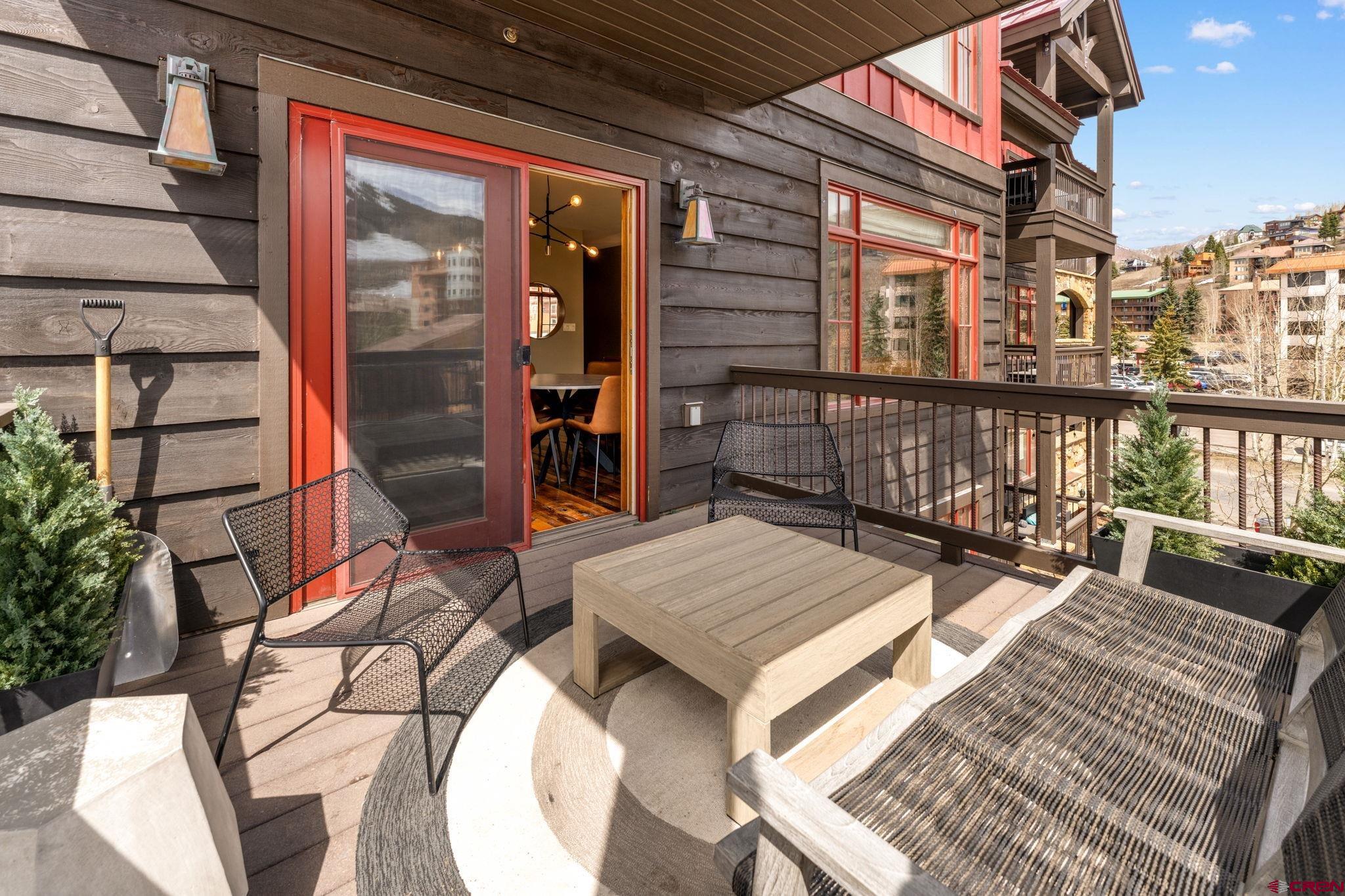 621 Gothic Road, Unit 2A Crested Butte, CO 81225 - Photo 12 of 34 view of a balcony with two chairs and a table