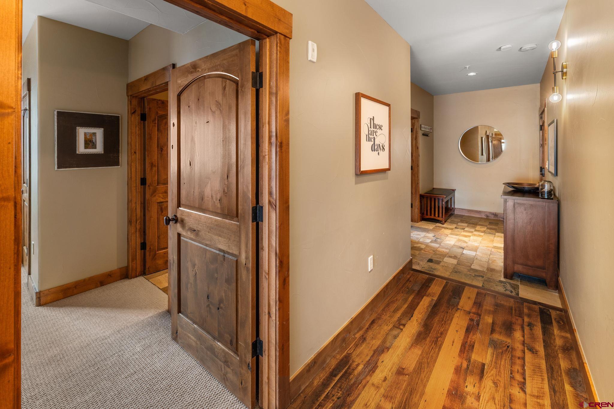 621 Gothic Road, Unit 2A Crested Butte, CO 81225 - Photo 15 of 34 a view of a hallway view with wooden floor and staircase