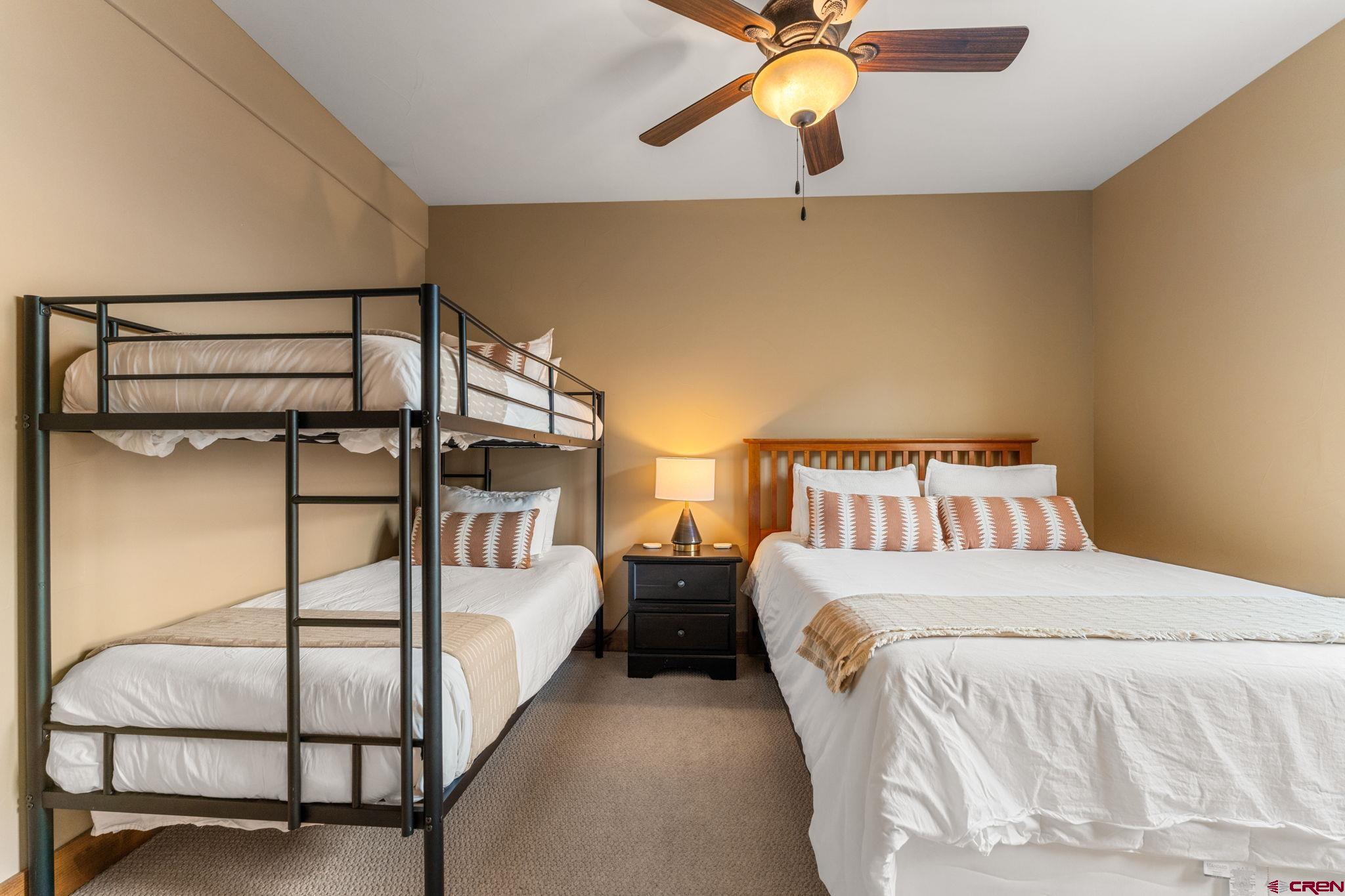 621 Gothic Road, Unit 2A Crested Butte, CO 81225 - Photo 22 of 34 a bedroom with double bed and window