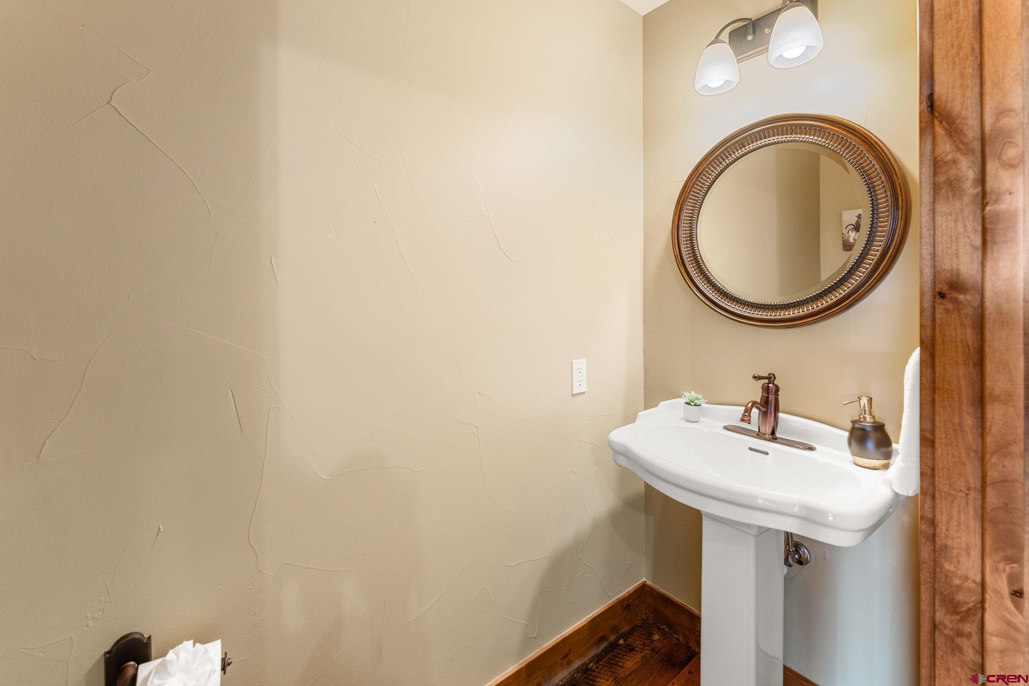 621 Gothic Road, Unit 2A Crested Butte, CO 81225 - Photo 25 of 34 a bathroom with a sink and a mirror