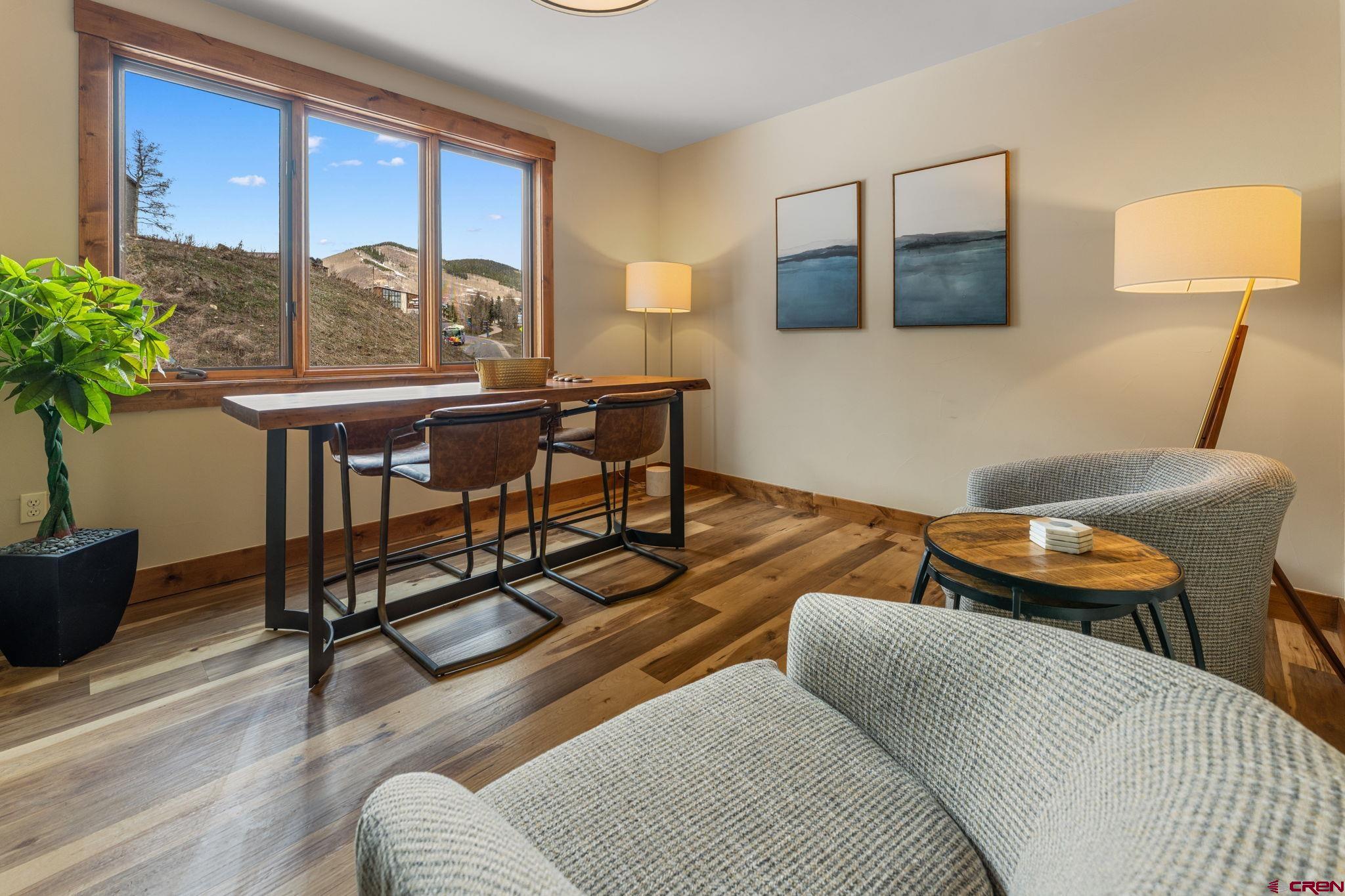 621 Gothic Road, Unit 2A Crested Butte, CO 81225 - Photo 29 of 34 a living room with furniture and a window