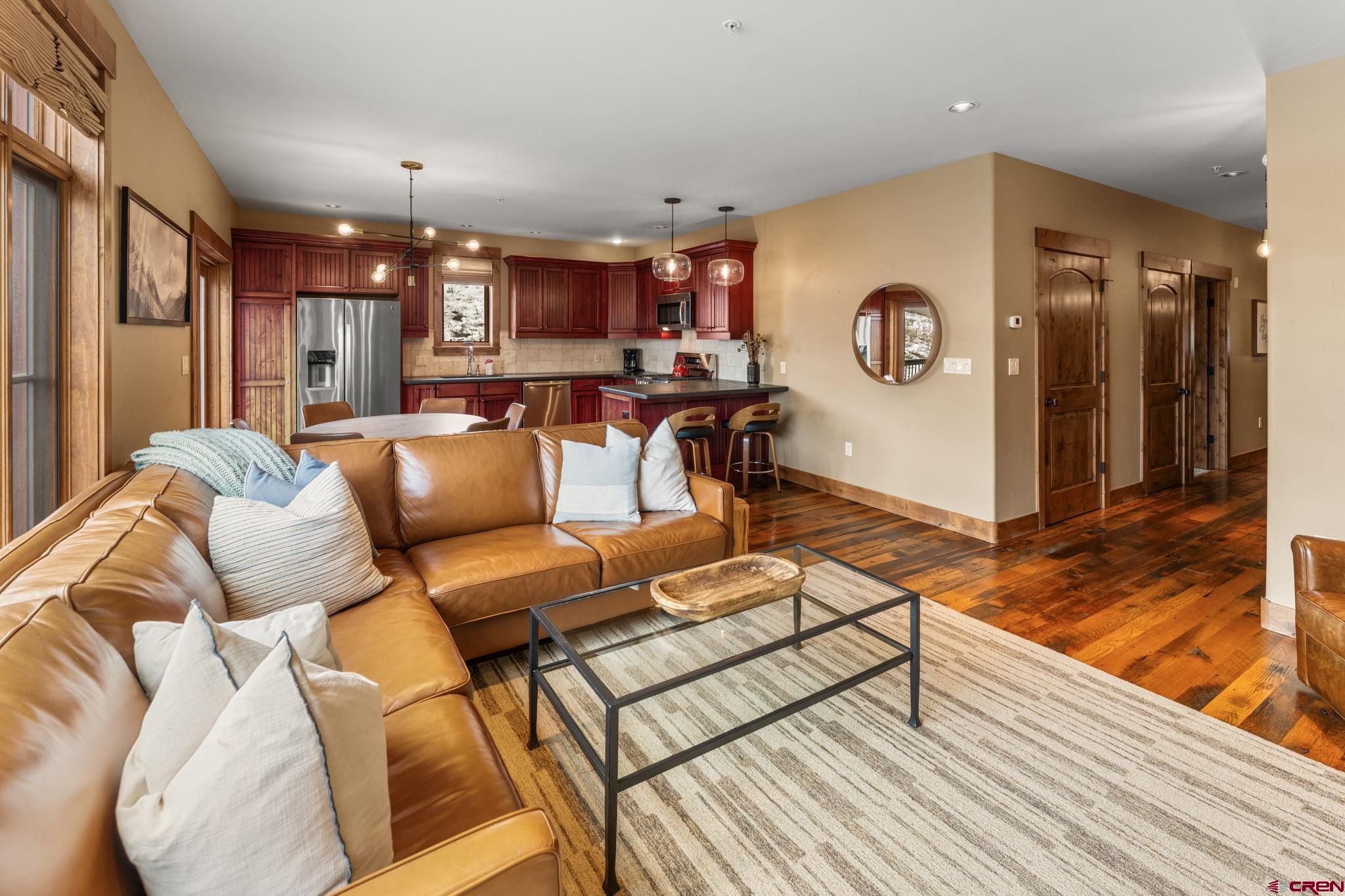 621 Gothic Road, Unit 2A Crested Butte, CO 81225 - Photo 6 of 34 a living room with furniture and a wooden floor