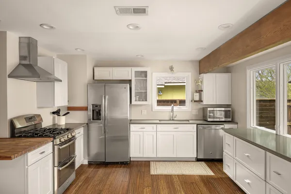a kitchen with a stove and a refrigerator