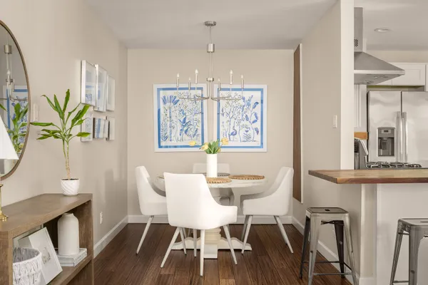 a living room with furniture and kitchen view