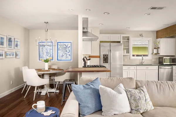 a kitchen with a sink a stove and cabinets