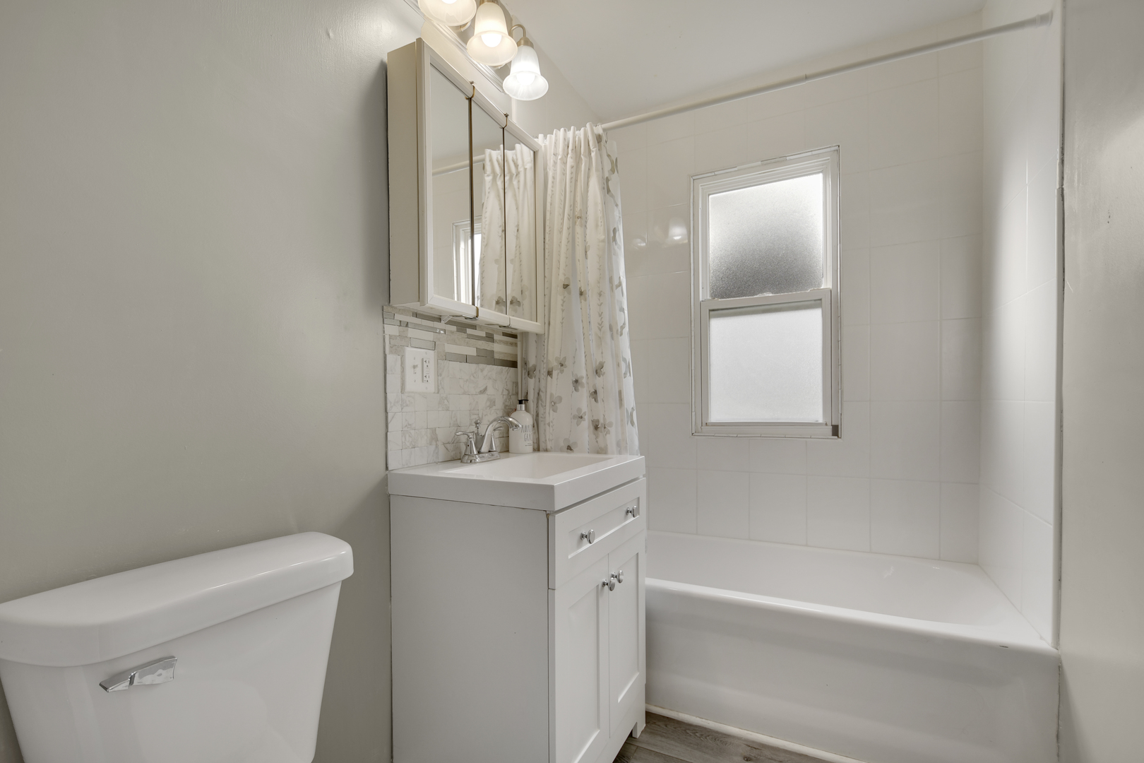 3737 Rose Manor Terrace Markham, IL 60428 - Photo 11 of 19 a bathroom with a sink a toilet and shower