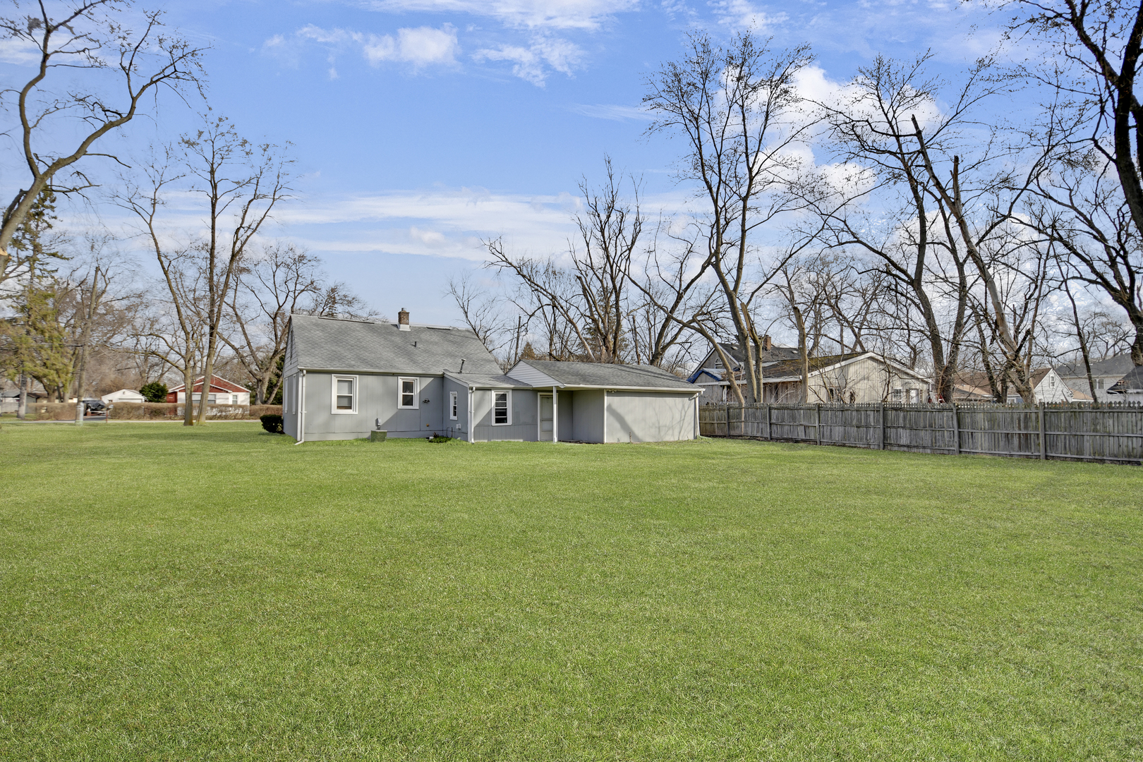 3737 Rose Manor Terrace Markham, IL 60428 - Photo 17 of 19 a view of a big house with a big yard and large trees