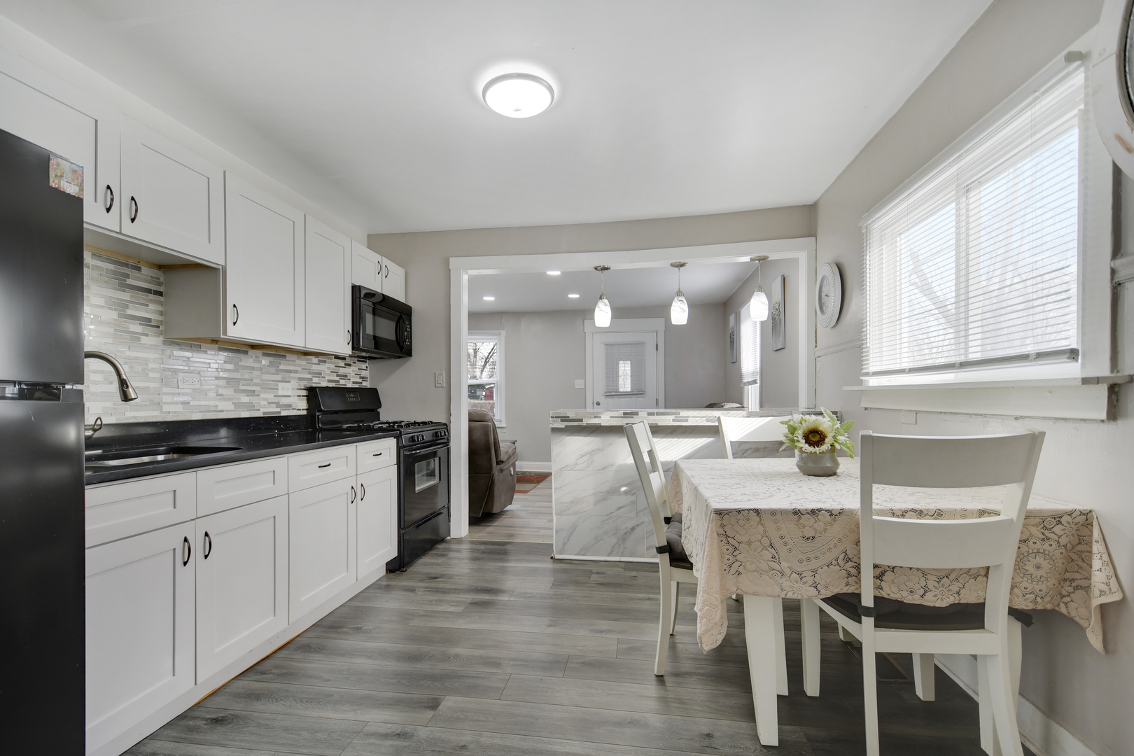 3737 Rose Manor Terrace Markham, IL 60428 - Photo 5 of 19 a large kitchen with granite countertop a large counter top appliances and cabinets