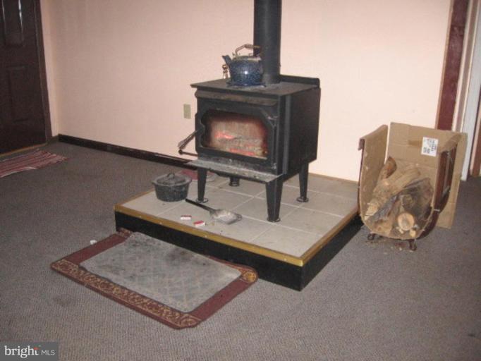 1577 Carpenters Point Road Perryville, MD 21903 - Photo 4 of 12 Woodstove to help keep you warm on a cold night