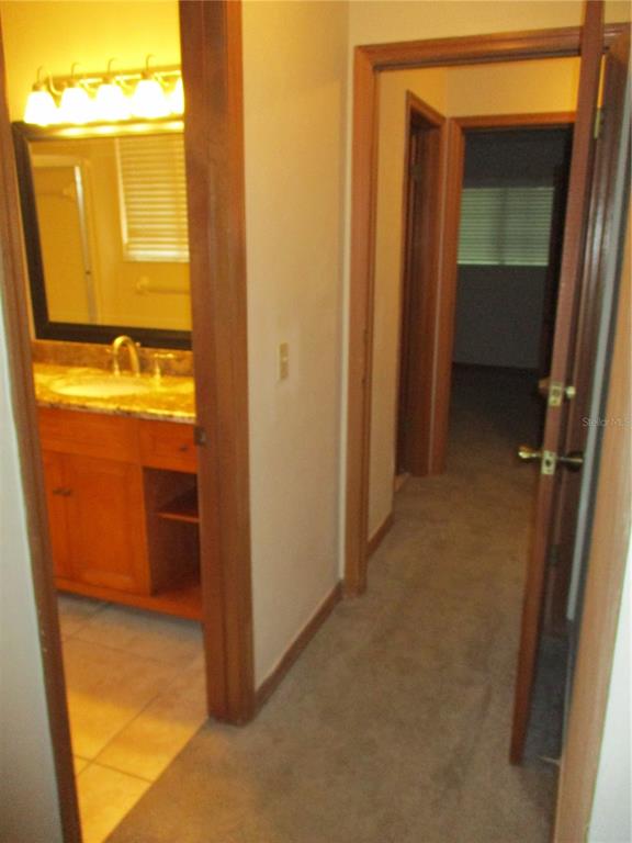 900 Southwest 62nd Boulevard, Unit D23 Gainesville, FL 32607 - Photo 19 of 37 a view of walk in closet with empty room