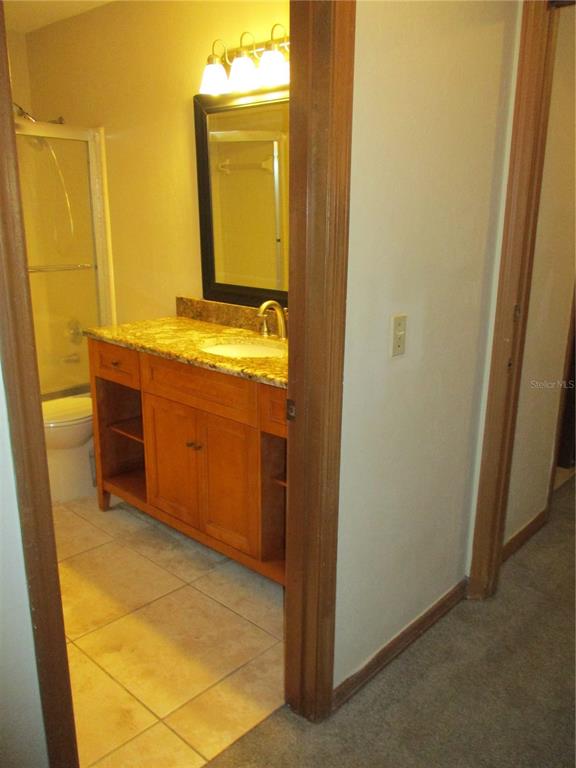 900 Southwest 62nd Boulevard, Unit D23 Gainesville, FL 32607 - Photo 21 of 37 a view of bathroom with sink and mirror