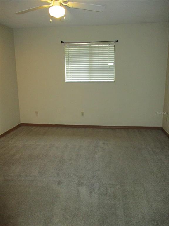 900 Southwest 62nd Boulevard, Unit D23 Gainesville, FL 32607 - Photo 22 of 37 an empty room with a workbench
