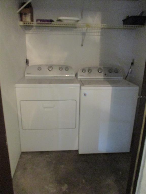 900 Southwest 62nd Boulevard, Unit D23 Gainesville, FL 32607 - Photo 26 of 37 a utility room with dryer and washer