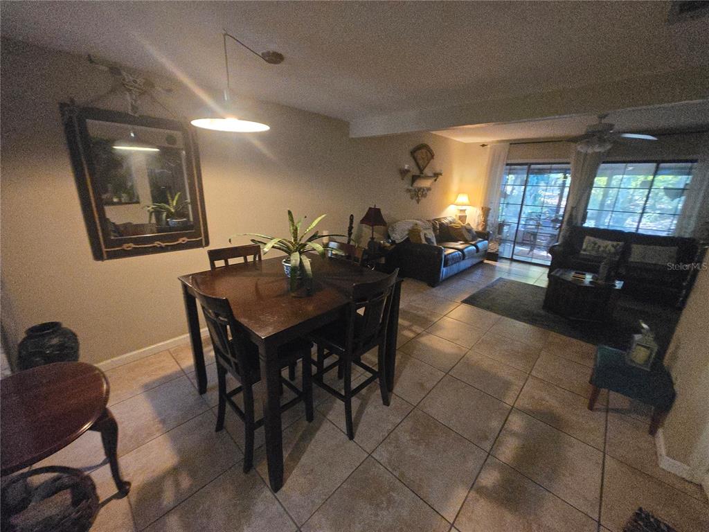 900 Southwest 62nd Boulevard, Unit D23 Gainesville, FL 32607 - Photo 28 of 37 a view of a dining room with furniture