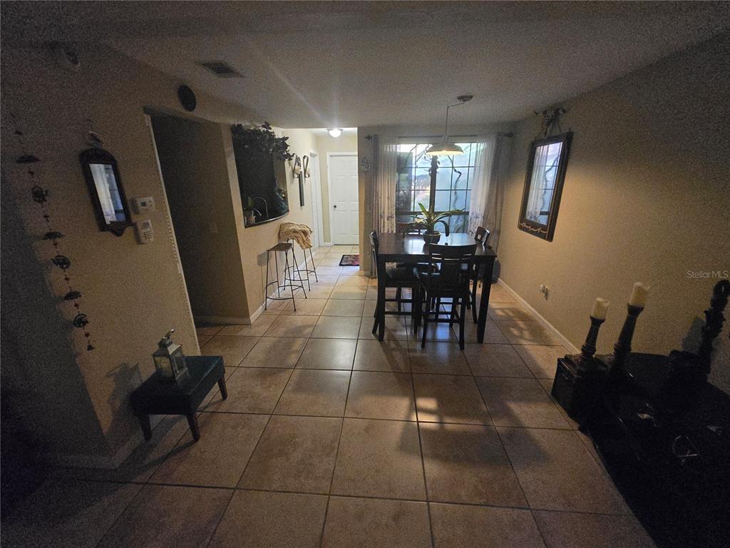 900 Southwest 62nd Boulevard, Unit D23 Gainesville, FL 32607 - Photo 33 of 37 a view of a dining room with furniture