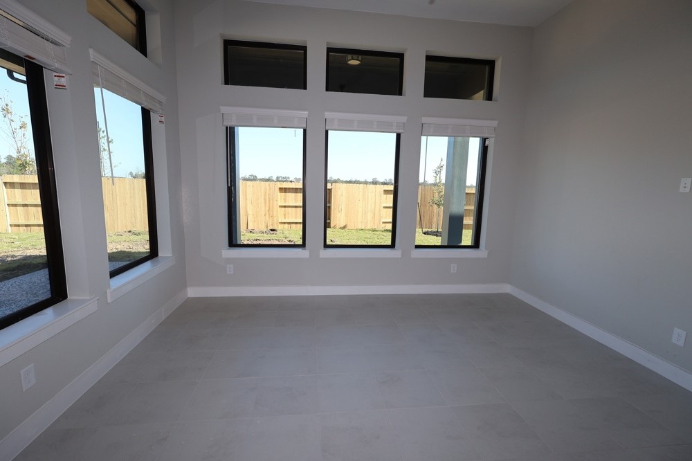 18603 Rumba Court Conroe, TX 77302 - Photo 6 of 15 a view of an empty room with a window