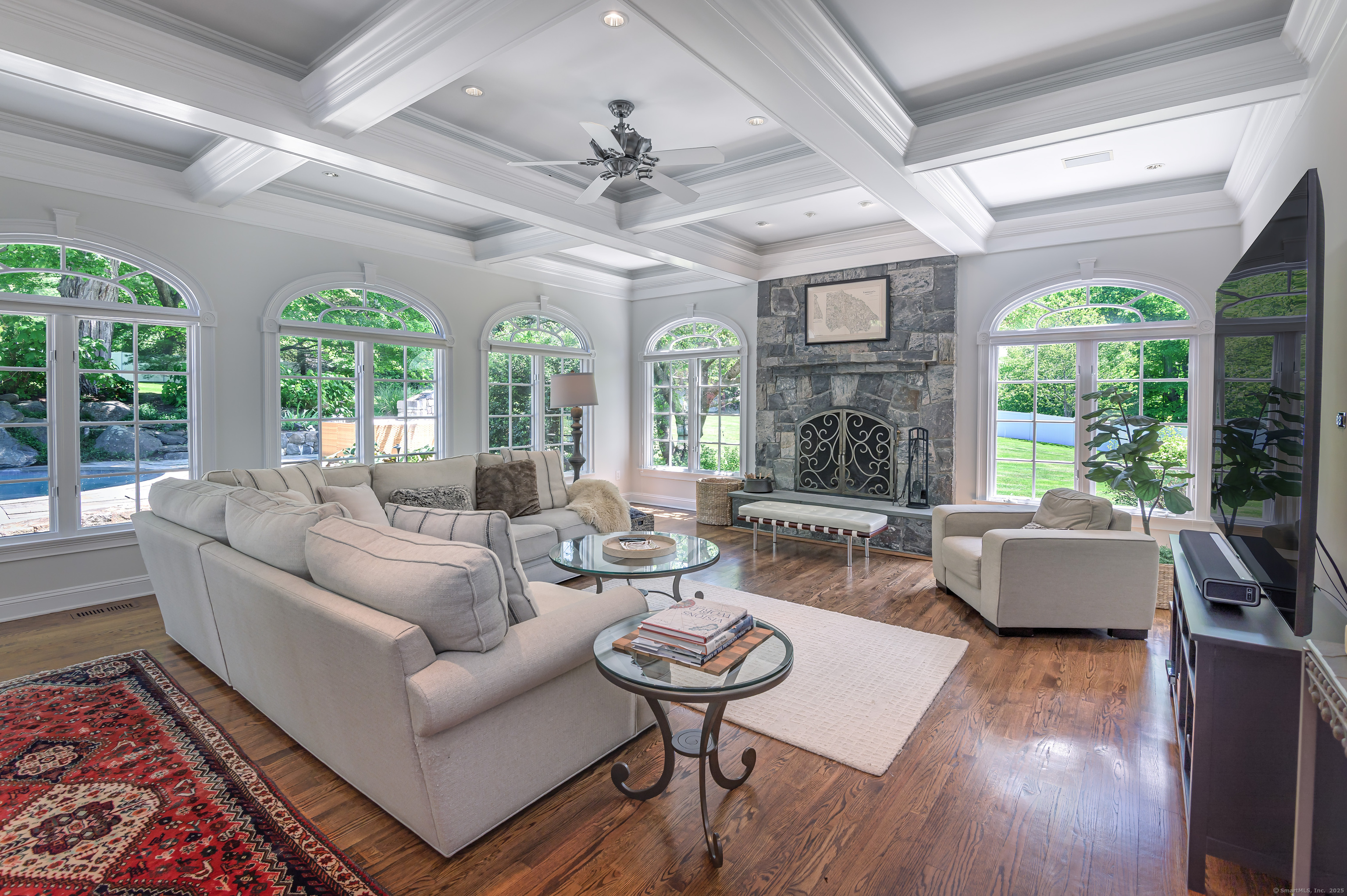 134 Nod Road Ridgefield, CT 06877 - Photo 11 of 40 a living room with furniture fireplace and a large window
