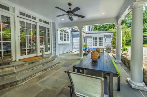 a view of a dining room with furniture window and outside view