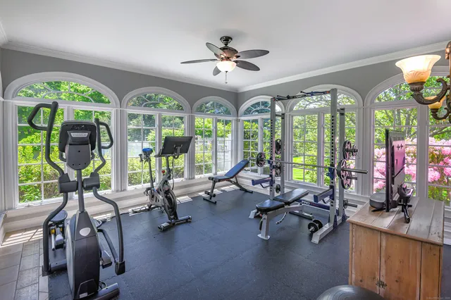a view of a livingroom with patio swimming pool