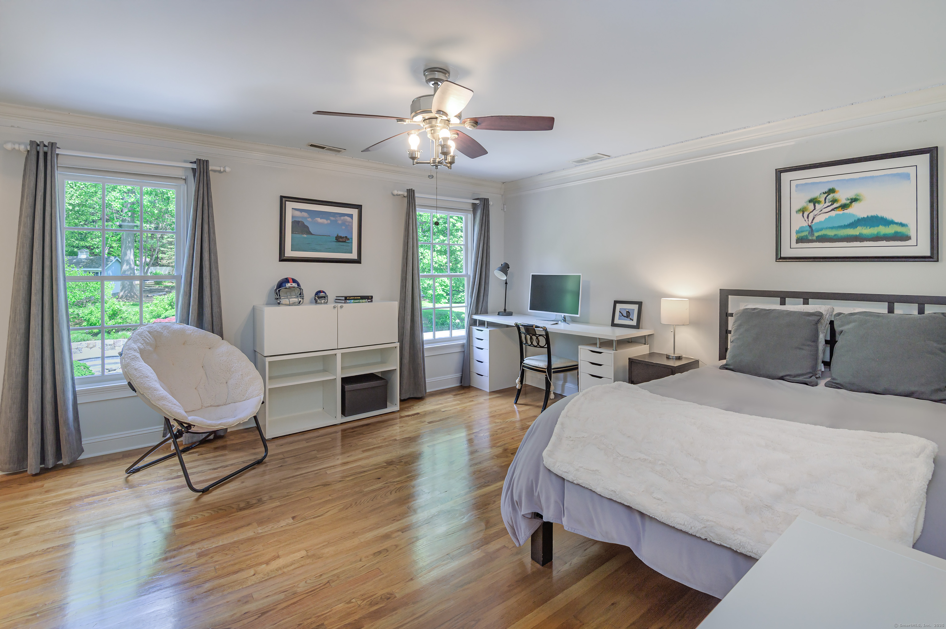 134 Nod Road Ridgefield, CT 06877 - Photo 29 of 40 a bedroom with a bed and a chandelier