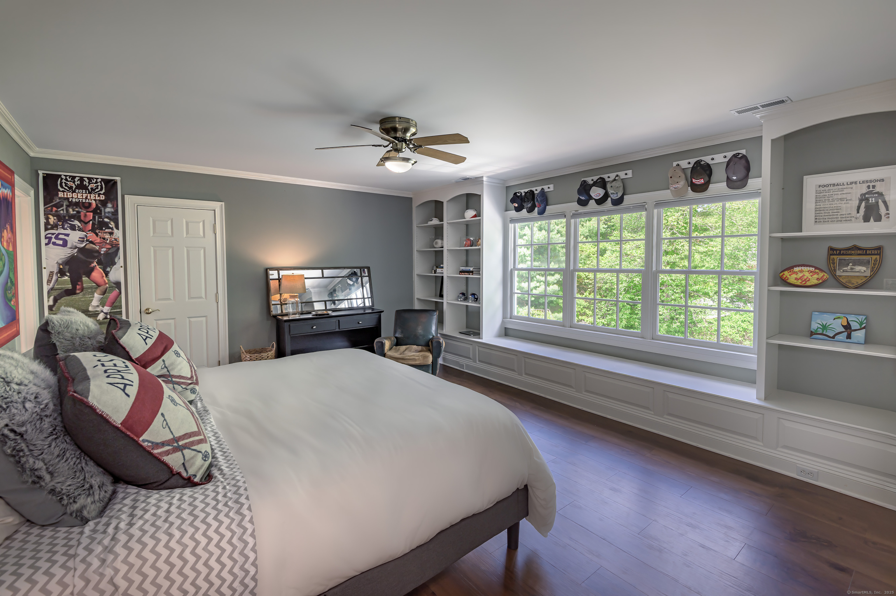 134 Nod Road Ridgefield, CT 06877 - Photo 31 of 40 a spacious bedroom with a bed a dresser and a chandelier