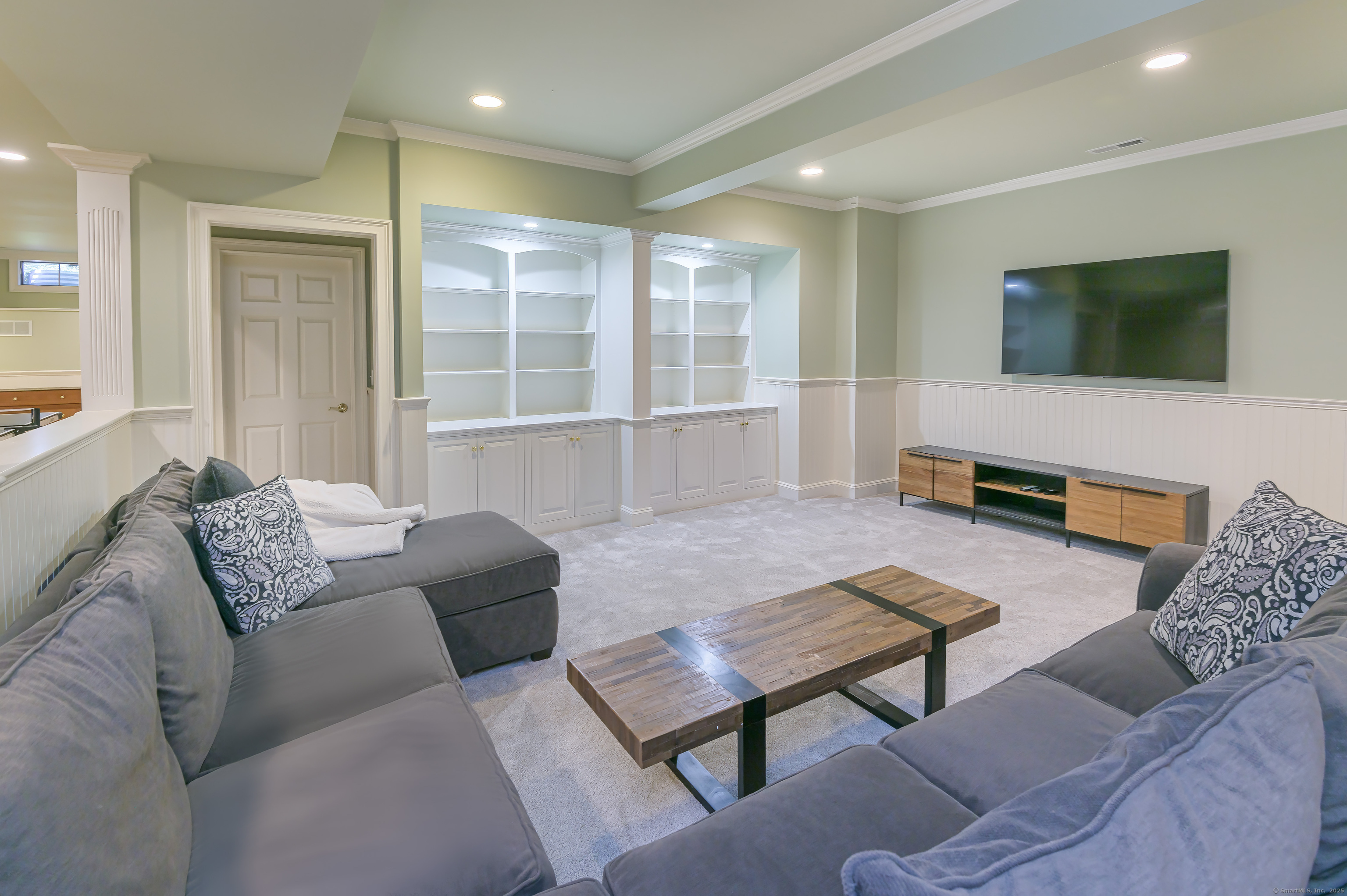 134 Nod Road Ridgefield, CT 06877 - Photo 34 of 40 a living room with furniture and a flat screen tv