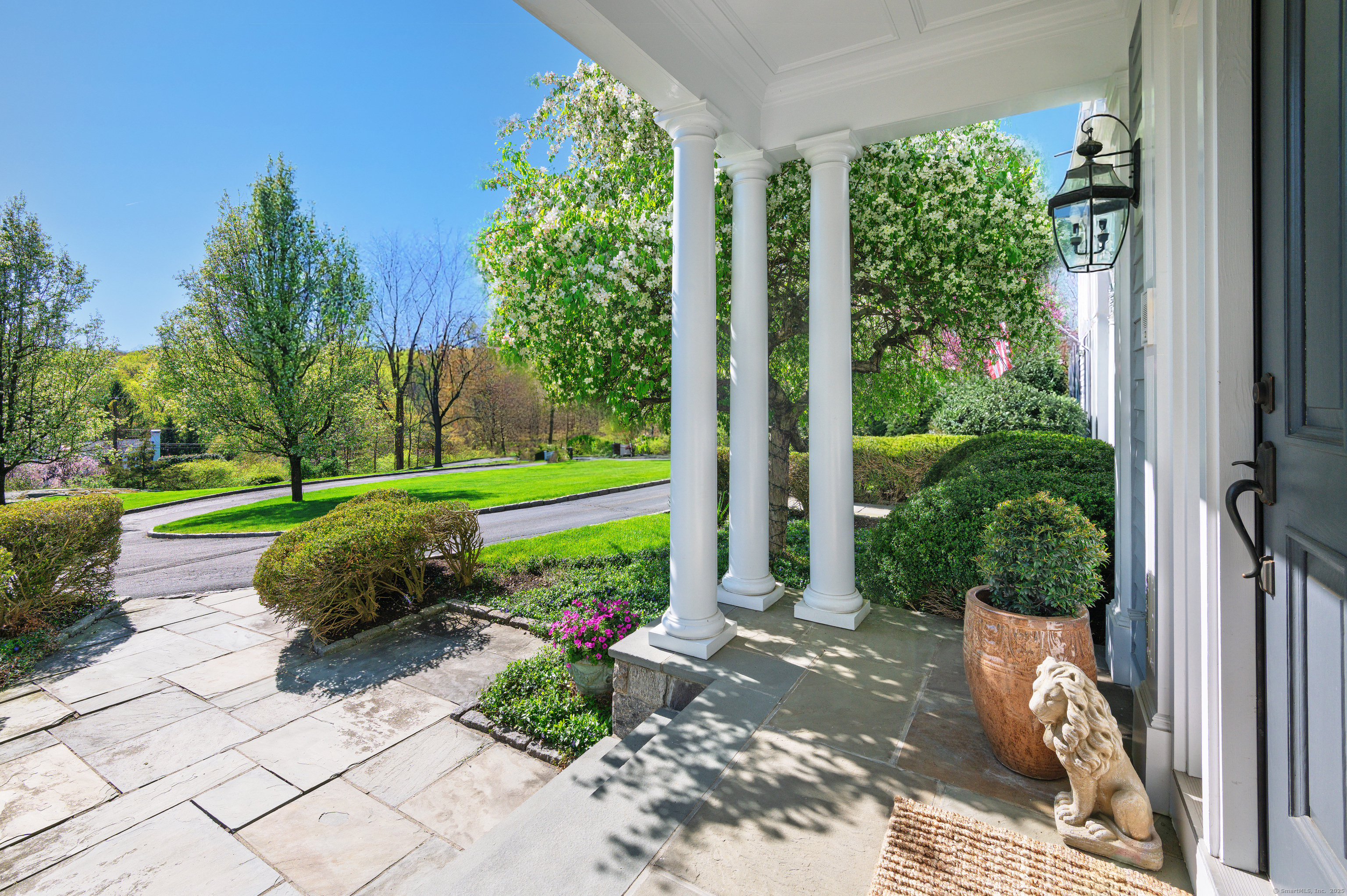 134 Nod Road Ridgefield, CT 06877 - Photo 7 of 40 a view of a garden with plants and large tree