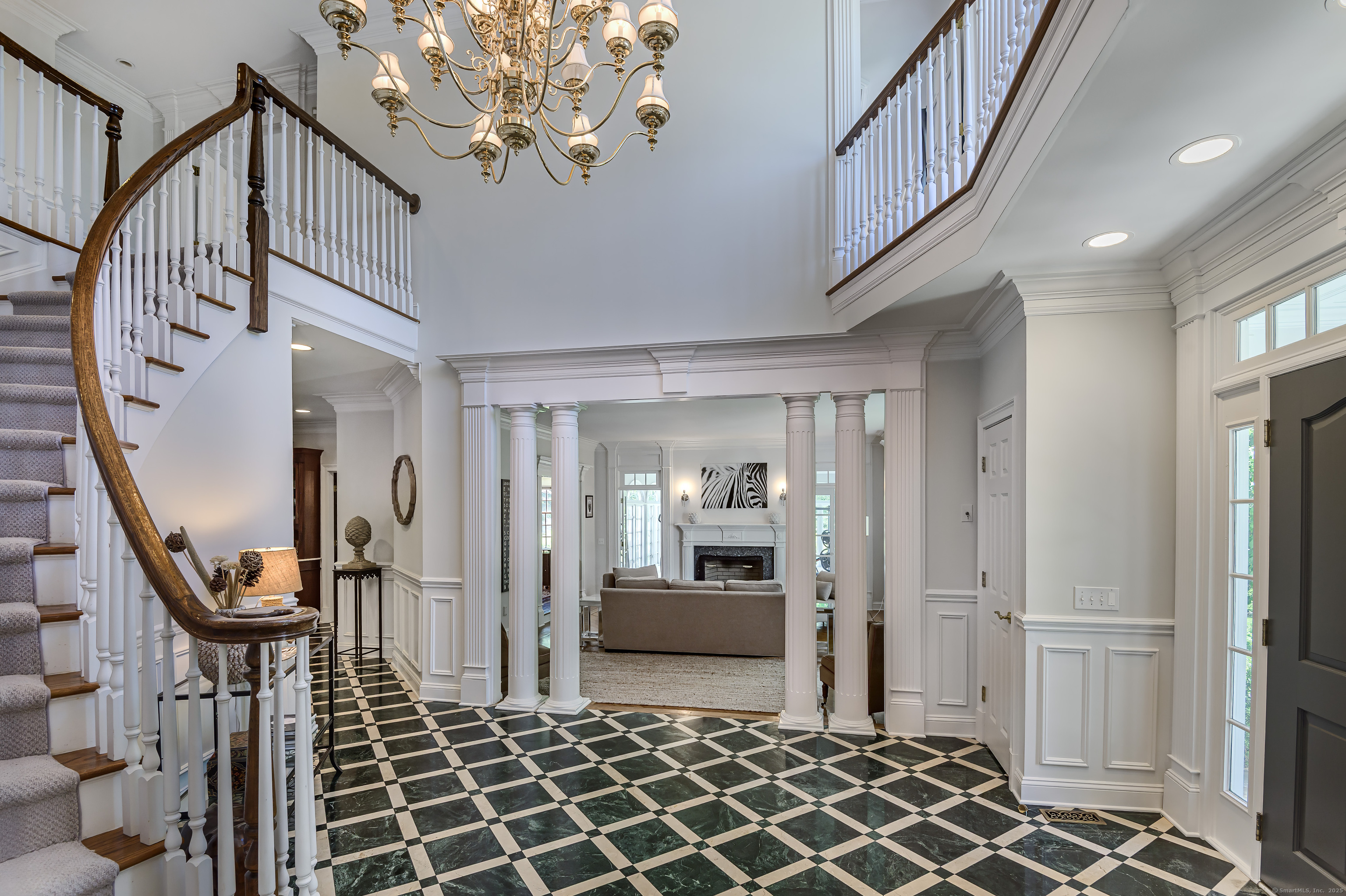 134 Nod Road Ridgefield, CT 06877 - Photo 8 of 40 a view of a hallway with wooden floor and staircase