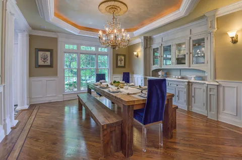 a view of a dining room with furniture window and wooden floor