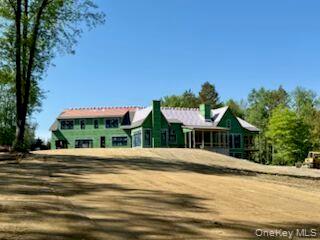 17 River Road North Chelsea, NY 12512 - Photo 16 of 19 a front view of a house with a yard